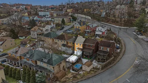 an aerial view of a backyard with wooden floor