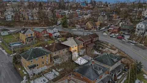 an aerial view of residential building with parking space
