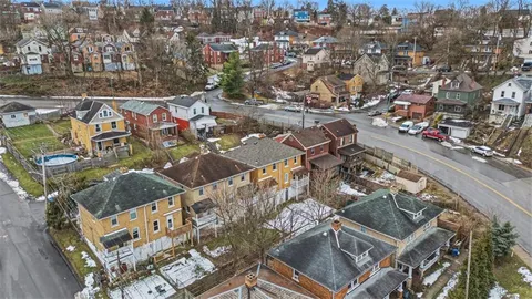 a view of a brick building with large windows