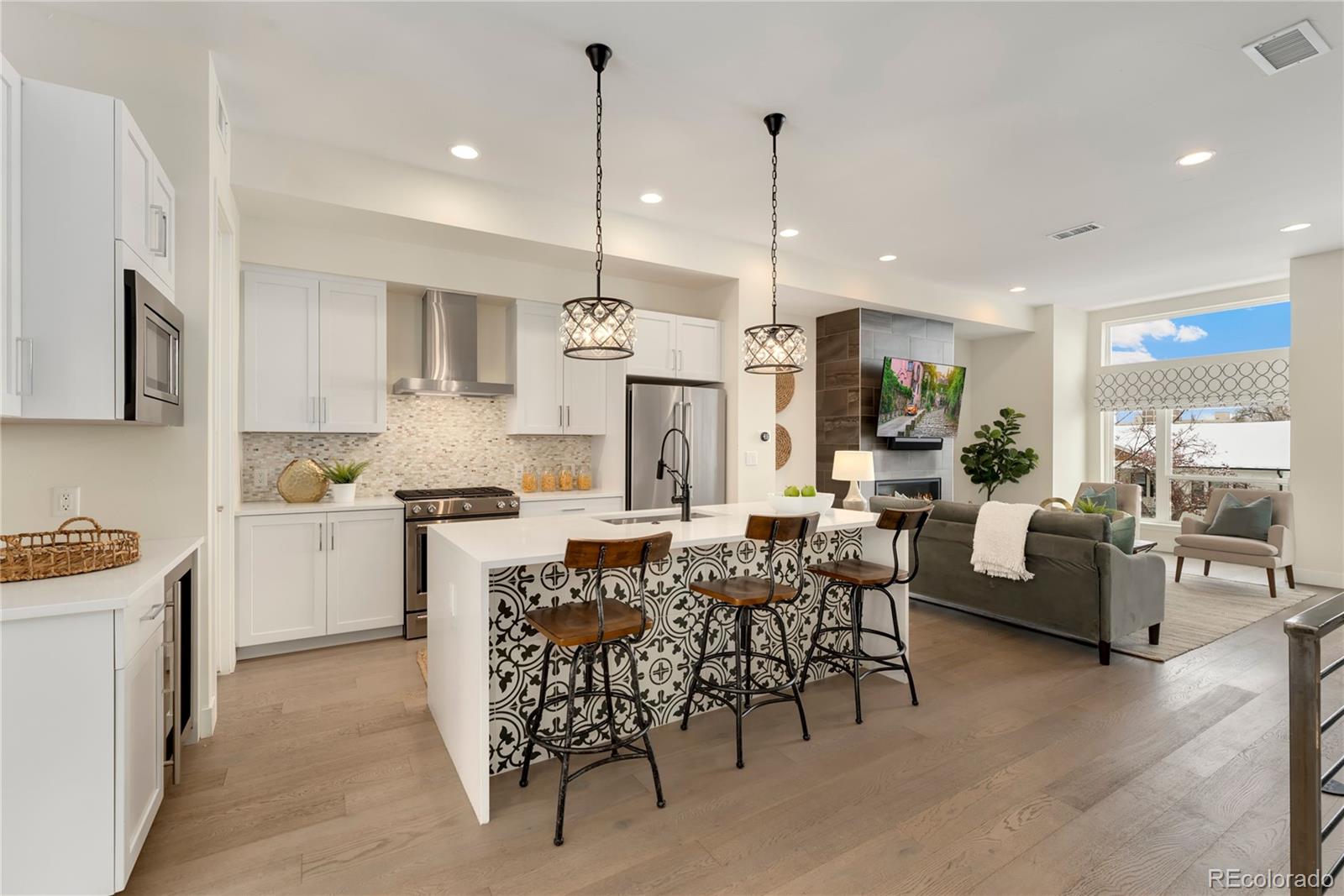1587 Perry Street Denver, CO 80204 - Photo 1 of 37 a large kitchen with a table and chairs