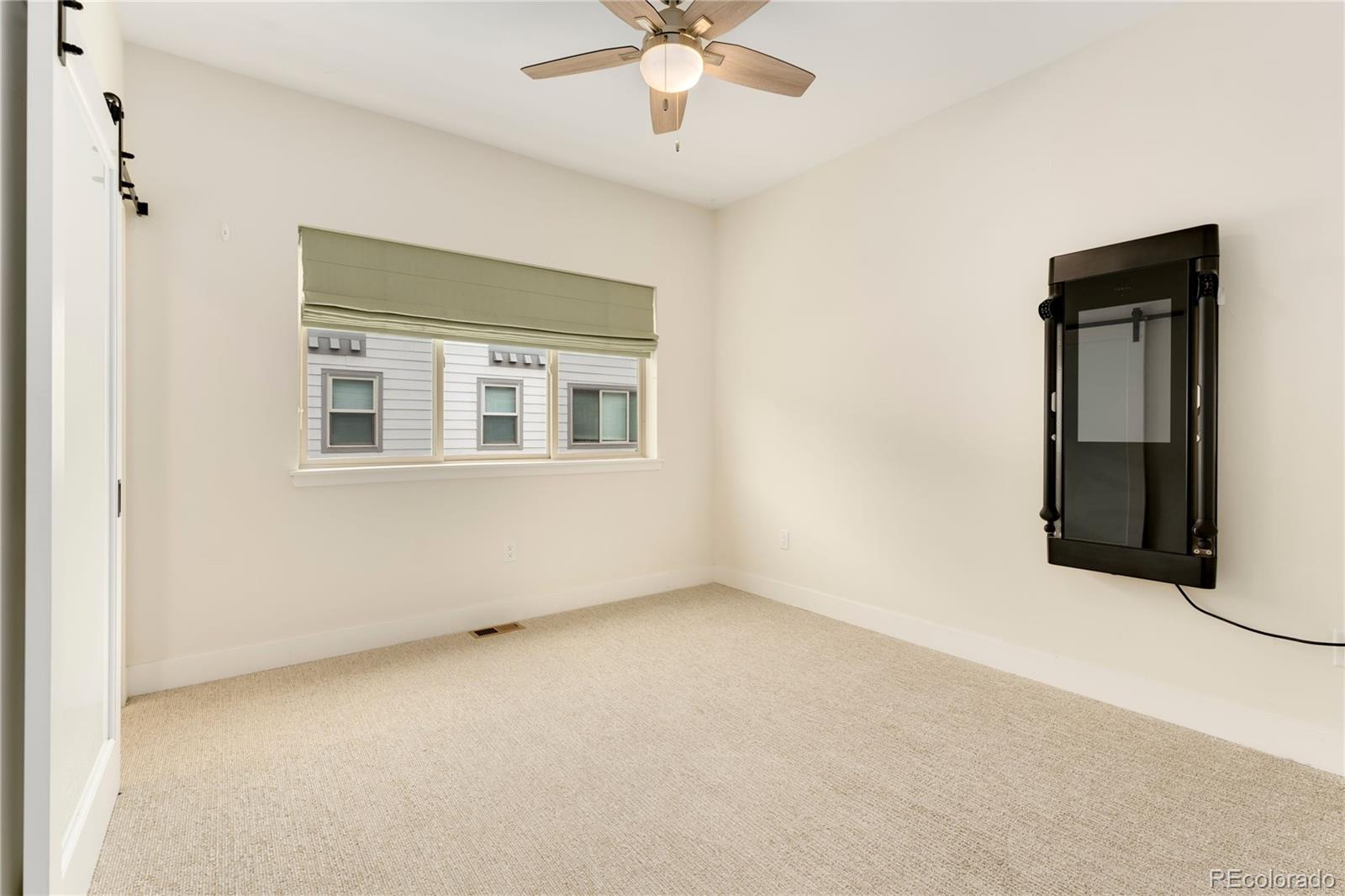 1587 Perry Street Denver, CO 80204 - Photo 15 of 37 a view of an empty room with a window