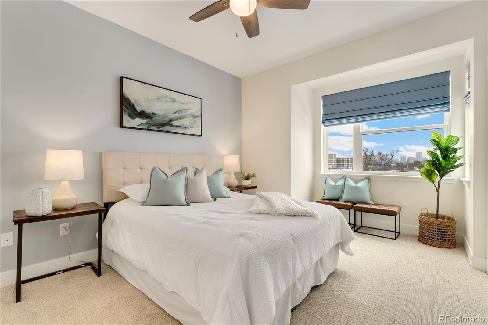 1587 Perry Street Denver, CO 80204 - Photo 18 of 37 a bedroom with bed and a chandelier