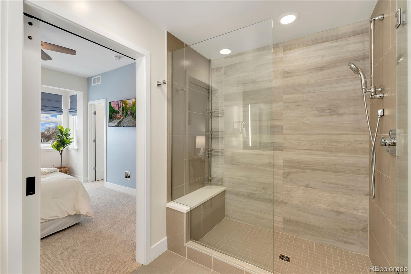 1587 Perry Street Denver, CO 80204 - Photo 23 of 37 a bathroom with a tub shower and a sink
