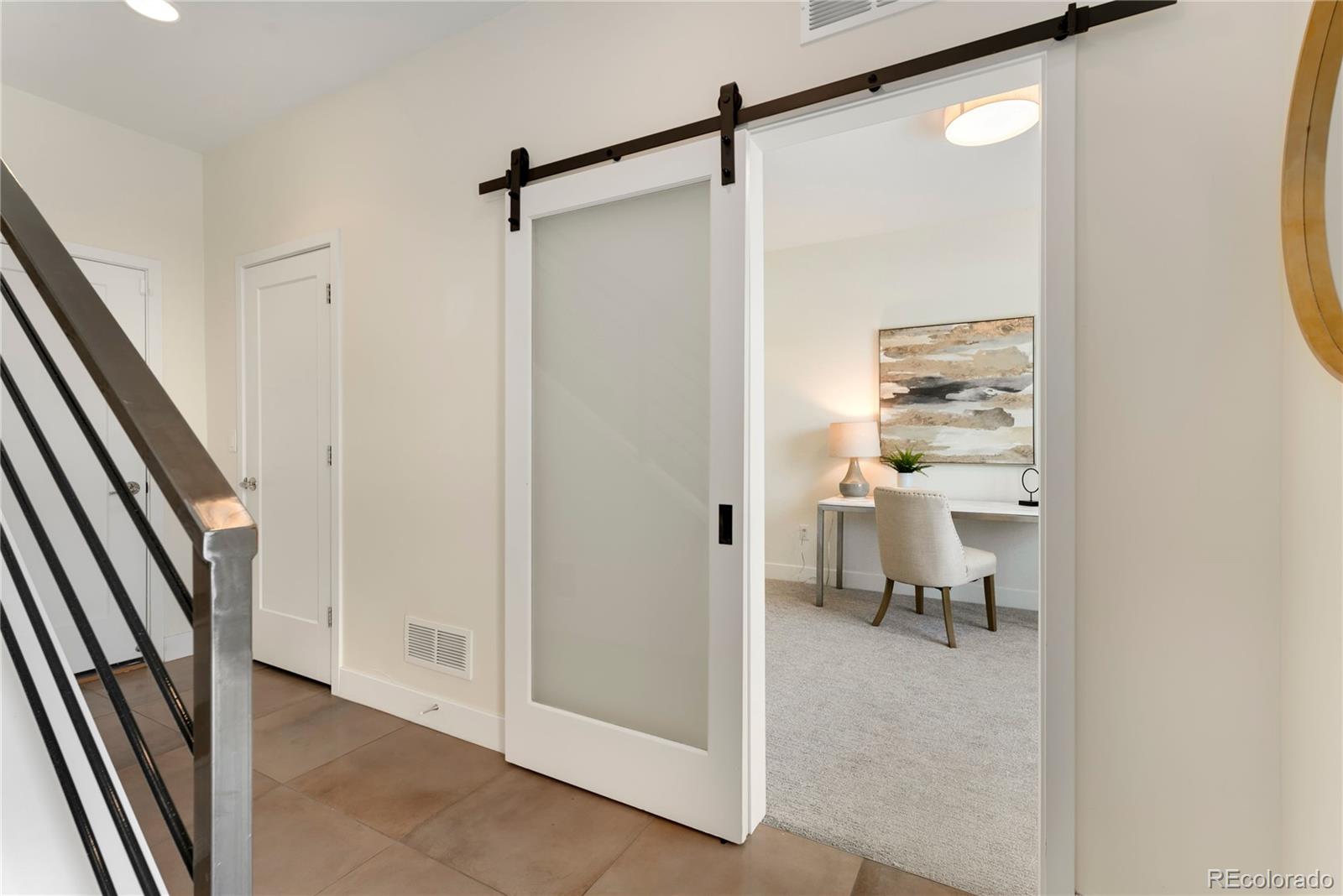 1587 Perry Street Denver, CO 80204 - Photo 26 of 37 a view of a hallway with a furniture and front door
