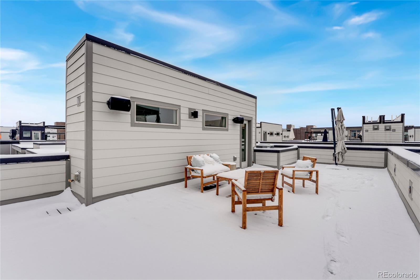 1587 Perry Street Denver, CO 80204 - Photo 31 of 37 a backyard of a house with table and chairs