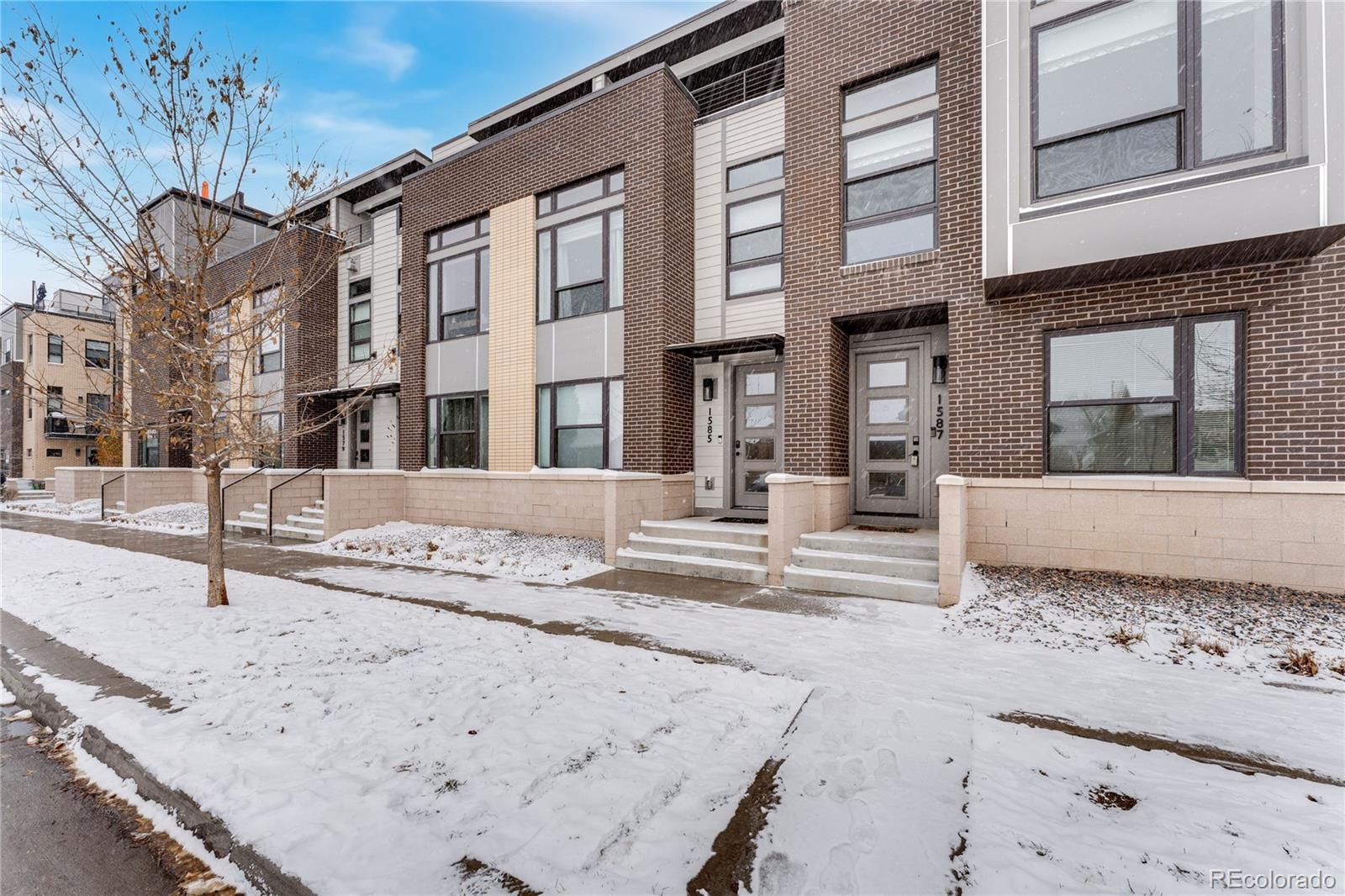 1587 Perry Street Denver, CO 80204 - Photo 36 of 37 a view of a building with snow on the road