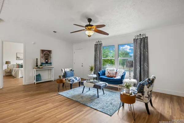 a living room with furniture and a window