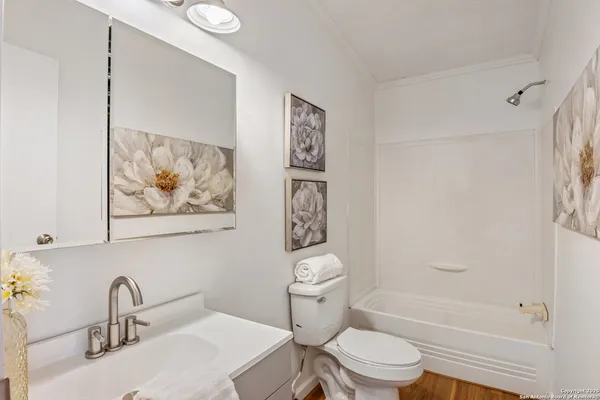 a bathroom with a toilet a sink and a bathtub