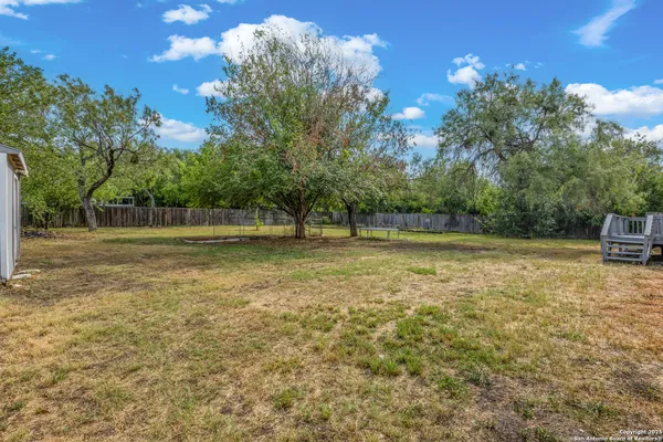 a backyard of a house with lots of green space