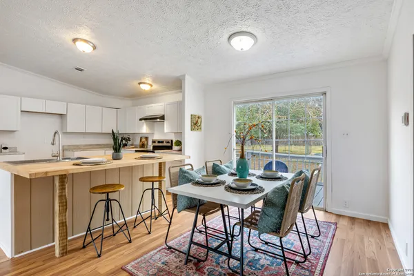 a kitchen with a table and chairs in it