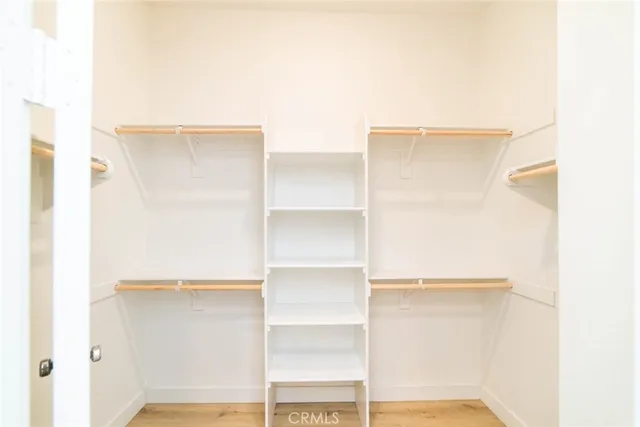 a close view of closet with wooden floor