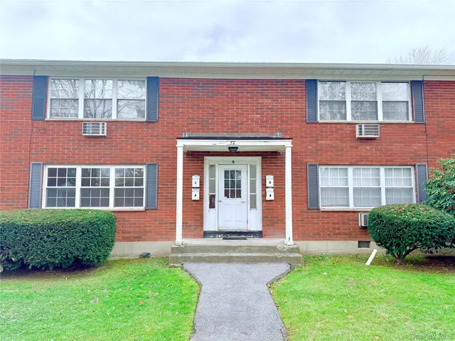 a view of yard with swimming pool and green space