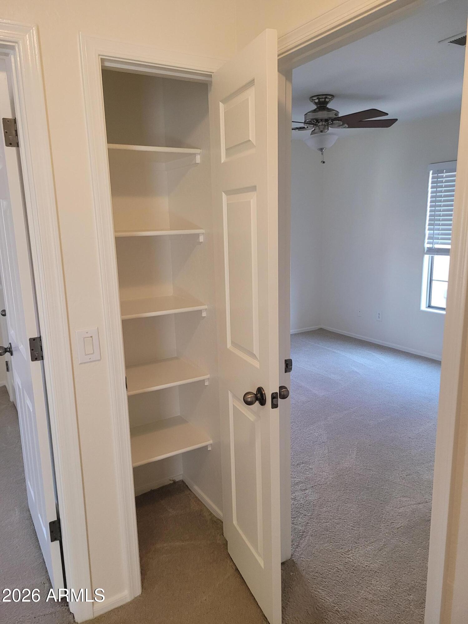 1453 South Sinova Avenue Gilbert, AZ 85296 - Photo 31 of 46 a view of a room with rack on the wall