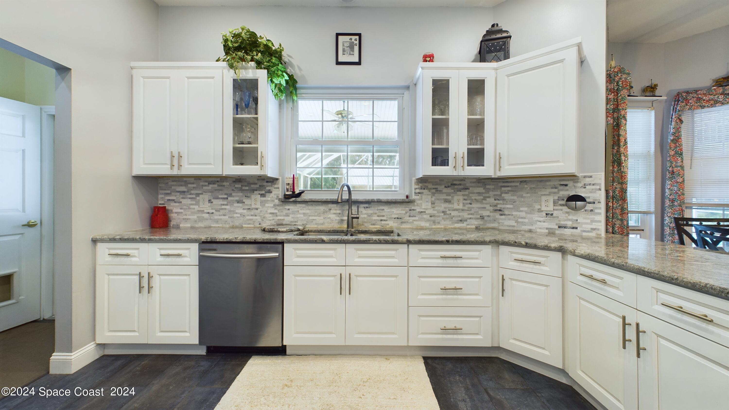 7746 Windover Way Titusville, FL 32780 - Photo 20 of 61 Kitchen/Pool View