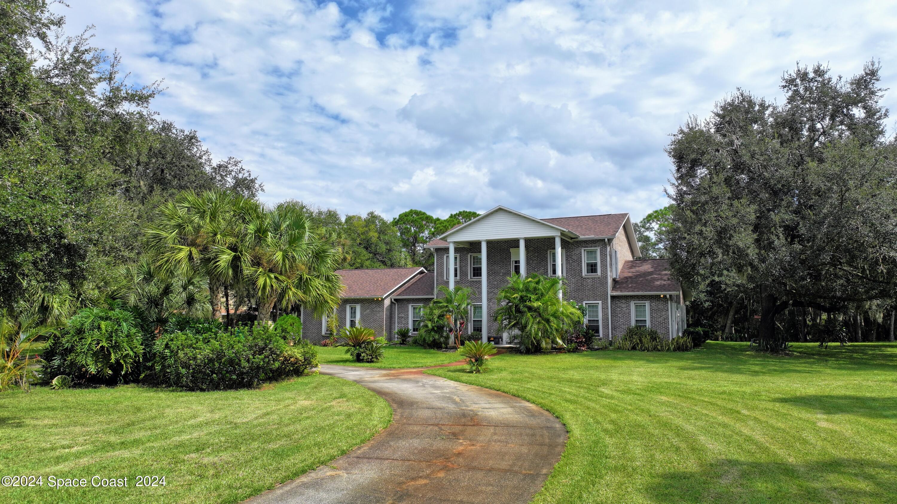 7746 Windover Way Titusville, FL 32780 - Photo 2 of 61 Front