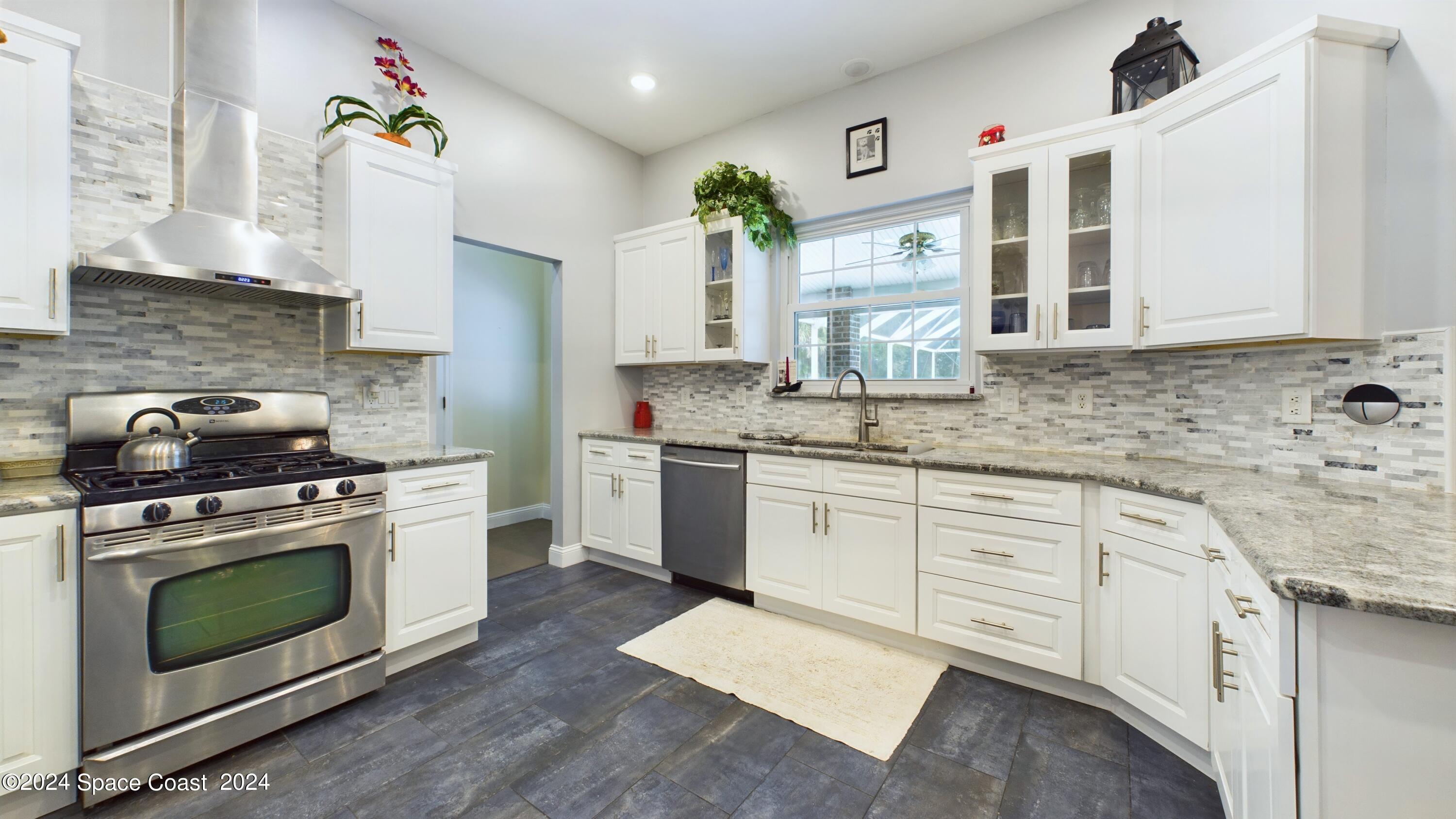 7746 Windover Way Titusville, FL 32780 - Photo 22 of 61 Kitchen/Laundry Entry
