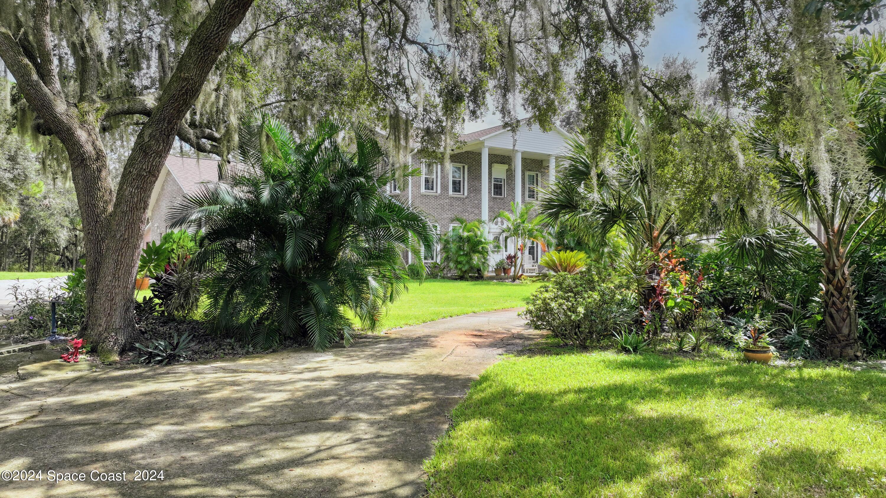 7746 Windover Way Titusville, FL 32780 - Photo 5 of 61 Front North Corner
