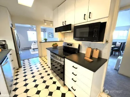 a bedroom with bed and wooden floor