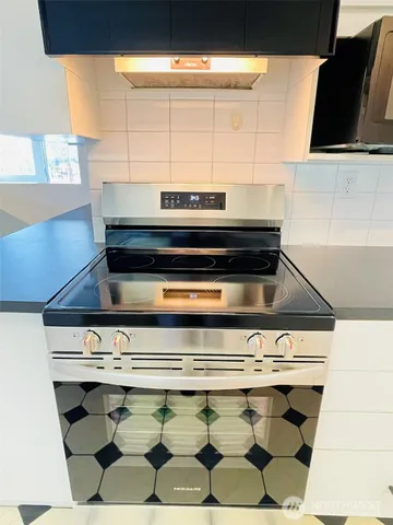 a bathroom with a double vanity sink and mirror