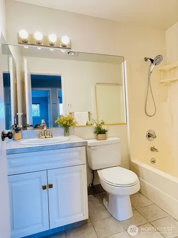 a bathroom with a double vanity sink and mirror