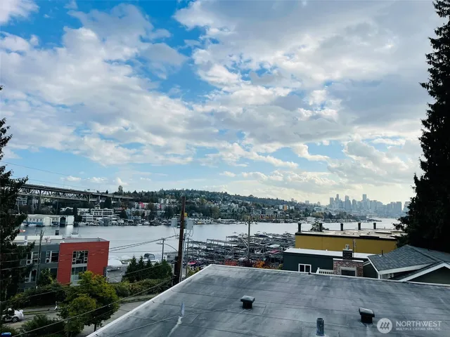 a kitchen with stainless steel appliances kitchen island granite countertop a sink and a stove