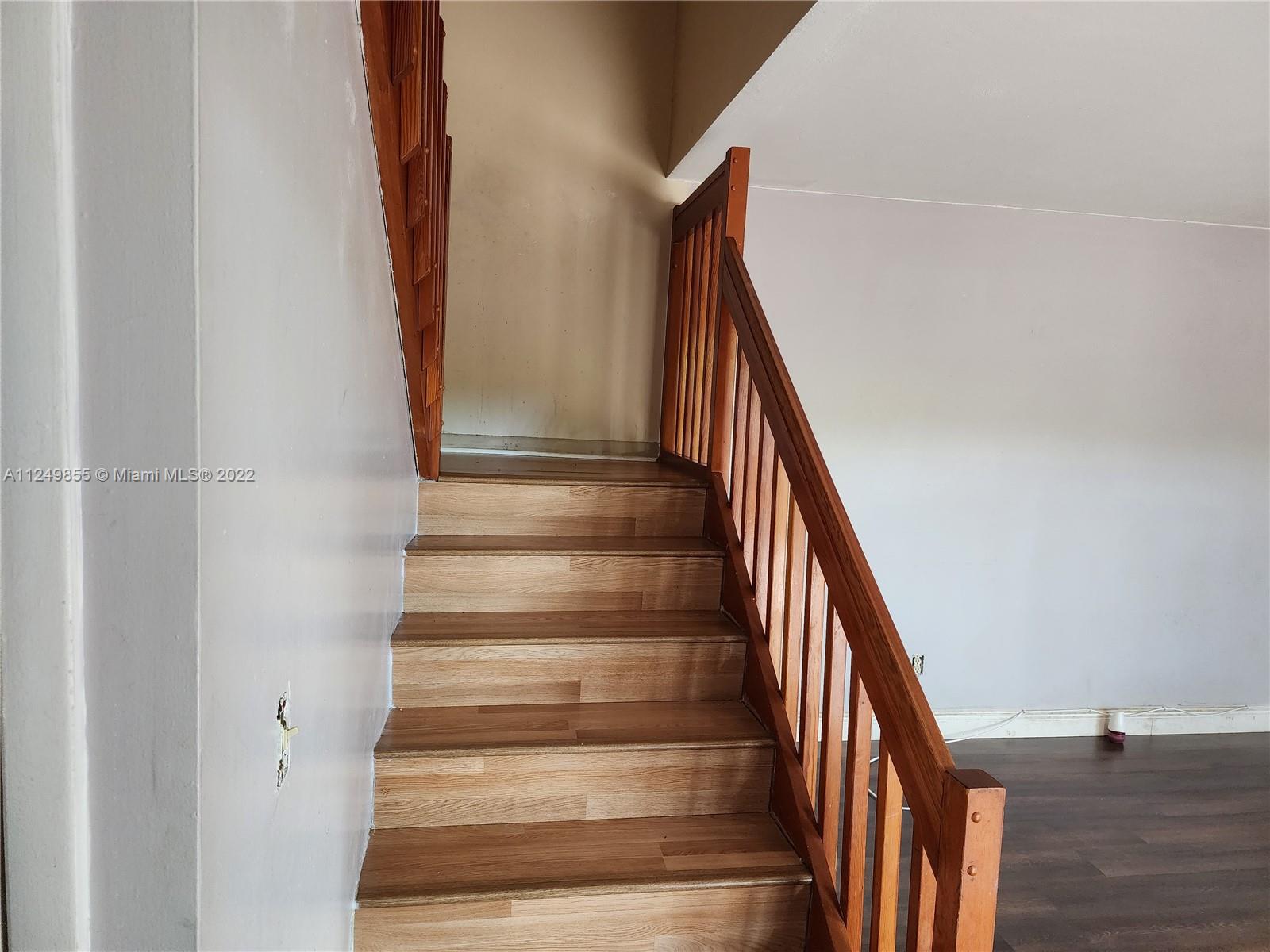 8139 Boca Rio Drive, Unit 8139 Boca Raton, FL 33433 - Photo 14 of 23 a view of entryway with wooden floor