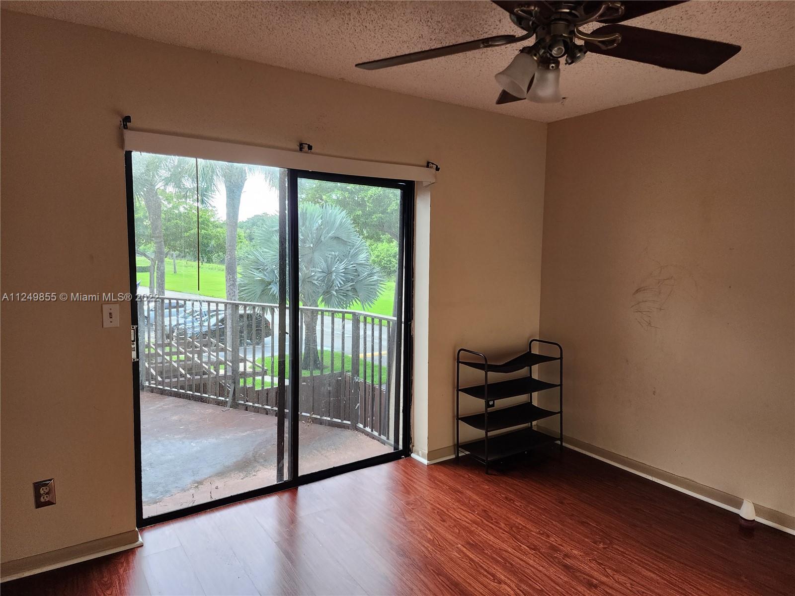 8139 Boca Rio Drive, Unit 8139 Boca Raton, FL 33433 - Photo 16 of 23 a view of a room with wooden floor and balcony