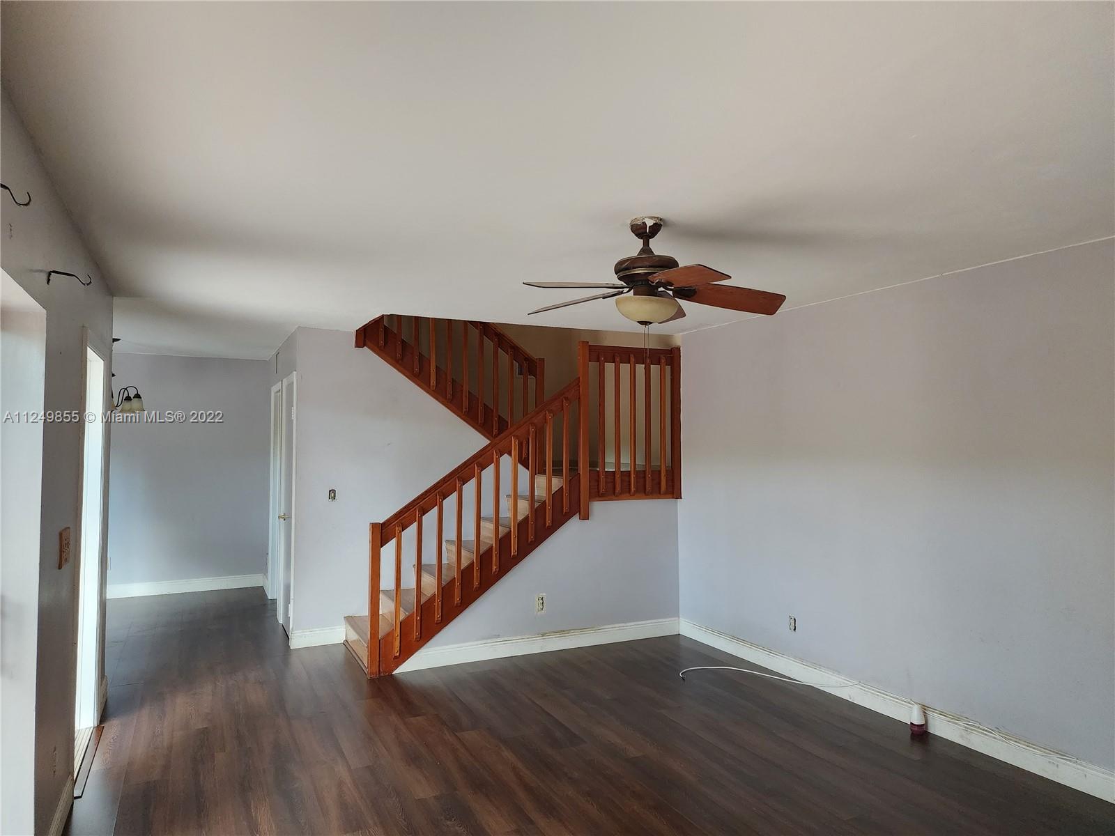8139 Boca Rio Drive, Unit 8139 Boca Raton, FL 33433 - Photo 9 of 23 a view of a hallway with wooden floor