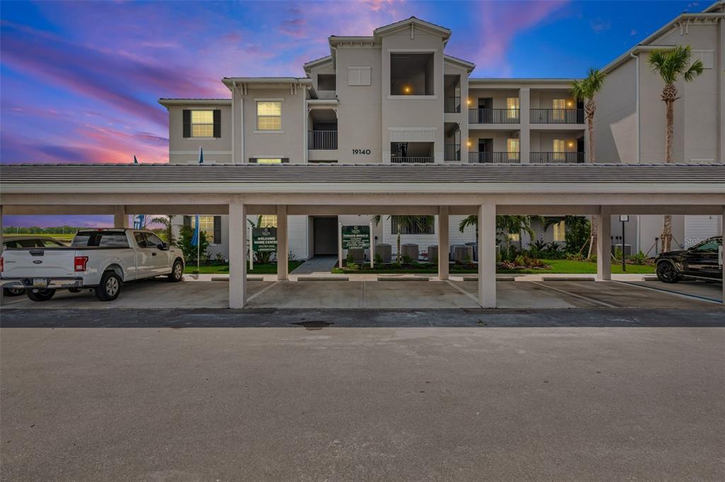 19140 Scallop Loop, Unit 401 Bradenton, FL 34211 - Photo 1 of 52 front view of a building with a street