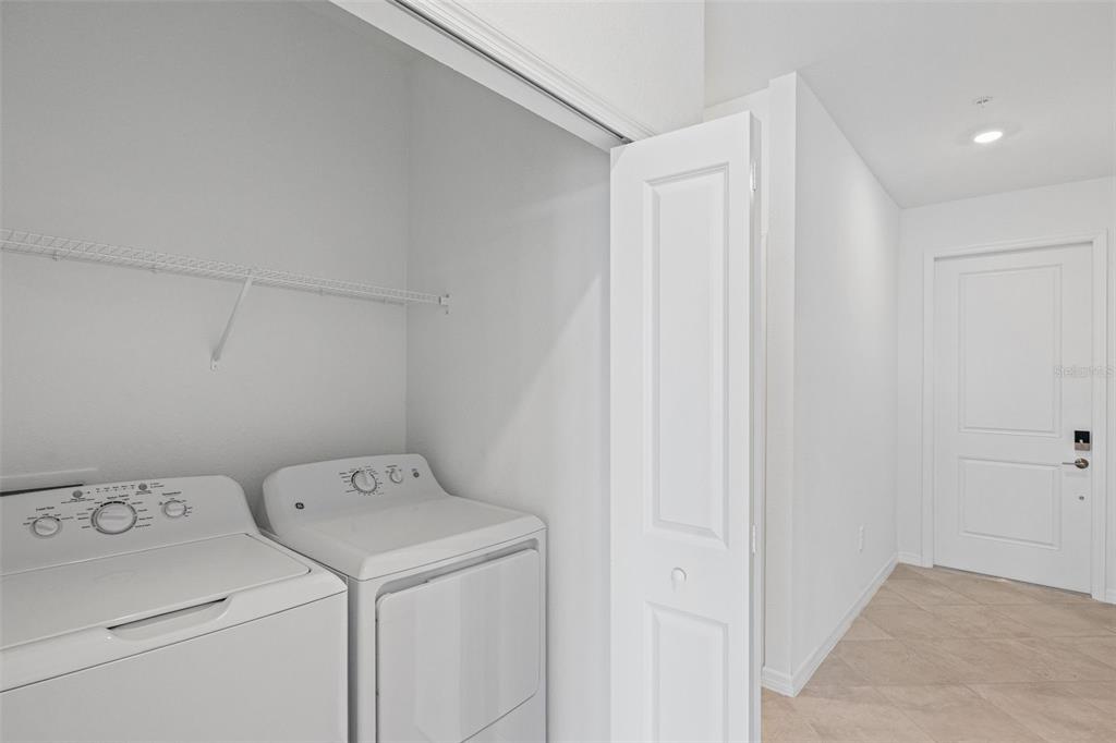 19140 Scallop Loop, Unit 401 Bradenton, FL 34211 - Photo 11 of 52 a view of storage and utility room with washer and dryer