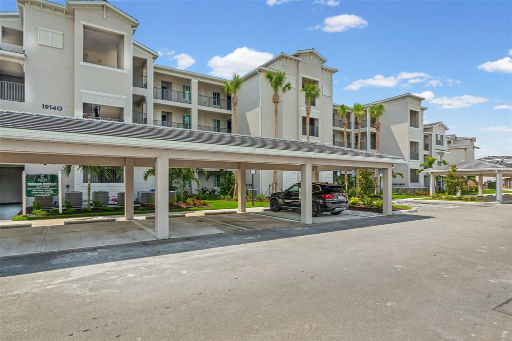 19140 Scallop Loop, Unit 401 Bradenton, FL 34211 - Photo 2 of 52 a view of a building with street