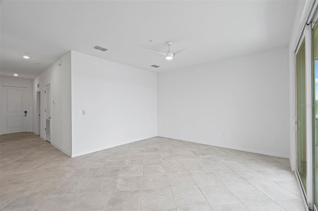 19140 Scallop Loop, Unit 401 Bradenton, FL 34211 - Photo 32 of 52 an empty room with an entryway