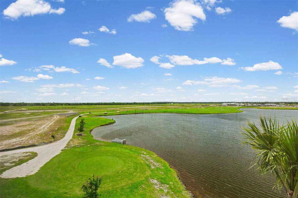 19140 Scallop Loop, Unit 401 Bradenton, FL 34211 - Photo 41 of 52 a view of a lake and a yard