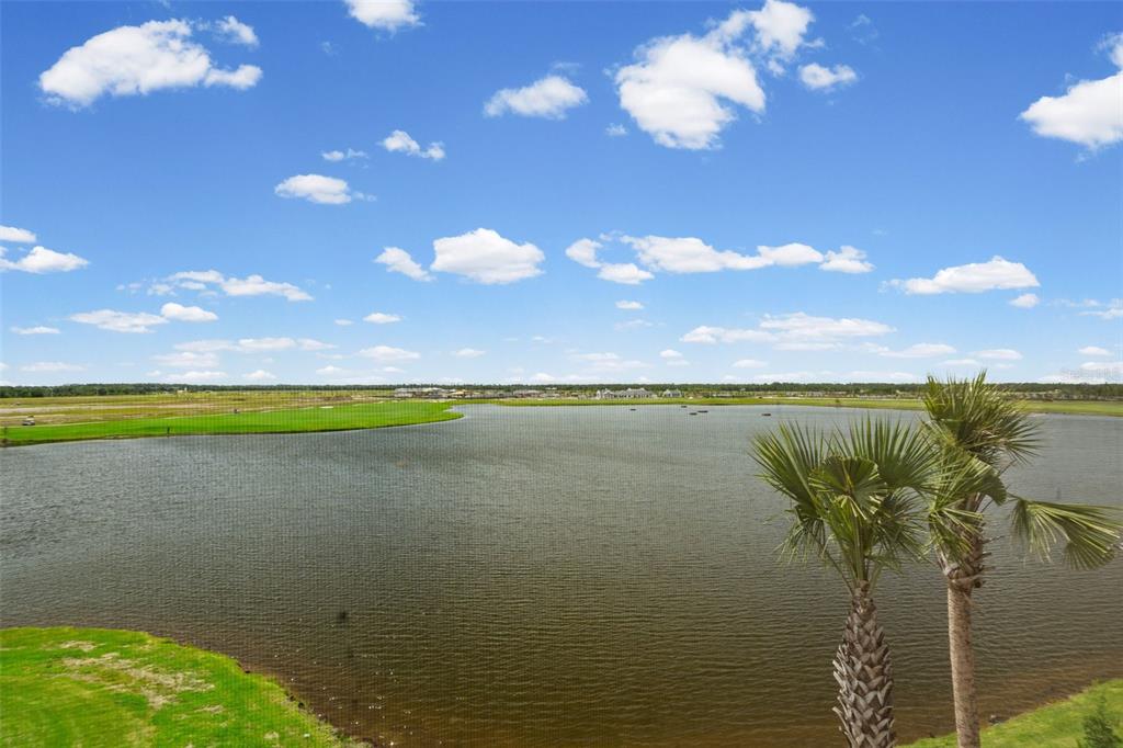 19140 Scallop Loop, Unit 401 Bradenton, FL 34211 - Photo 43 of 52 a view of a lake and a yard