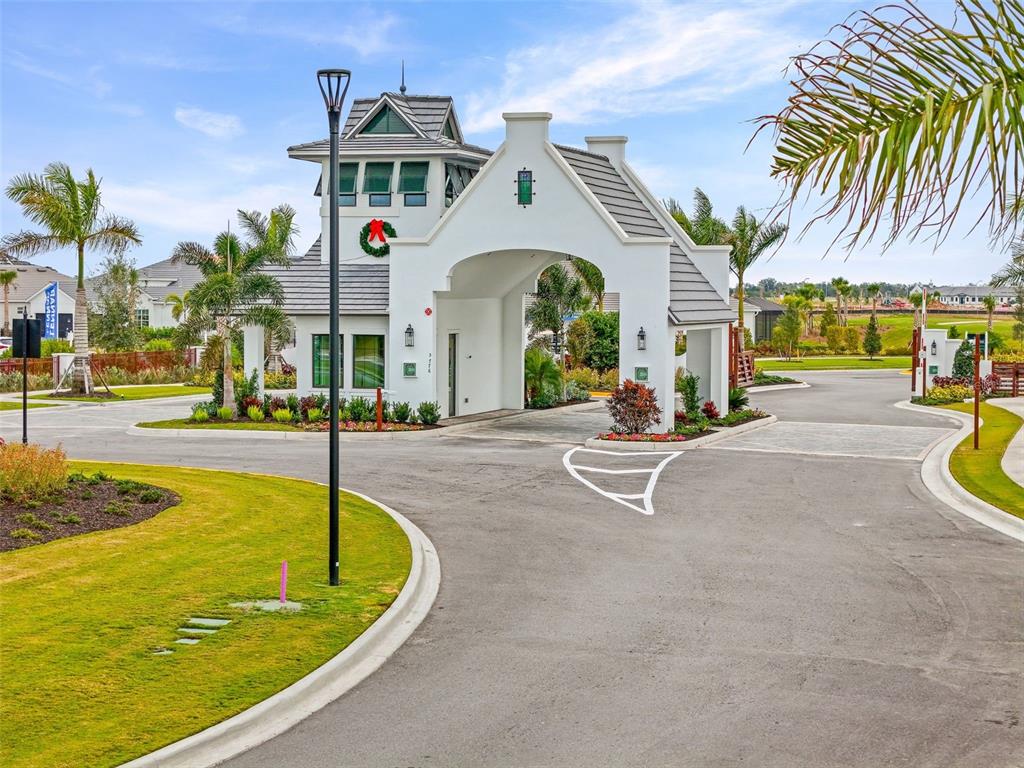 19140 Scallop Loop, Unit 401 Bradenton, FL 34211 - Photo 45 of 52 a swimming pool with outdoor seating and yard