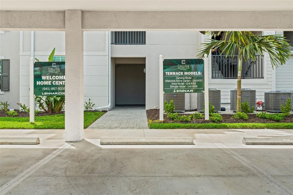 19140 Scallop Loop, Unit 401 Bradenton, FL 34211 - Photo 5 of 52 a front view of a house with a garden and plants