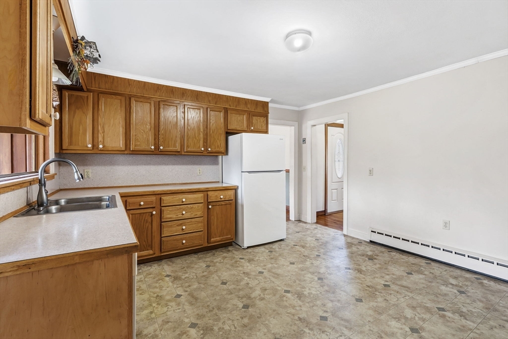 17 Moose Brook Road Southampton, MA 01073 - Photo 11 of 38 a kitchen with refrigerator a stove a sink dishwasher and wooden cabinets with wooden floor
