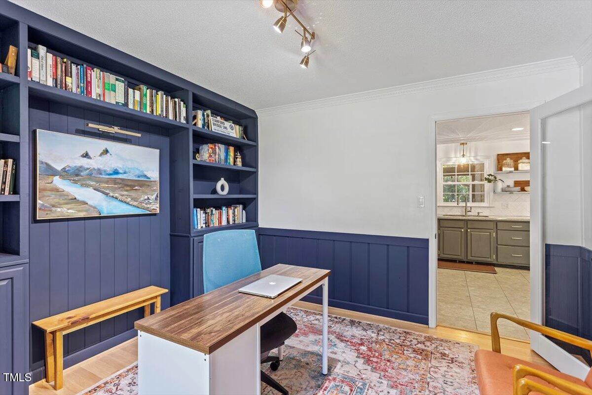 4912 Elizabeth Drive Raleigh, NC 27604 - Photo 12 of 35 a room with furniture and book shelf