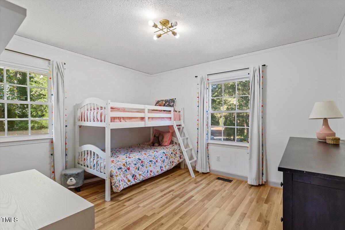 4912 Elizabeth Drive Raleigh, NC 27604 - Photo 19 of 35 a bedroom with a bed and a window