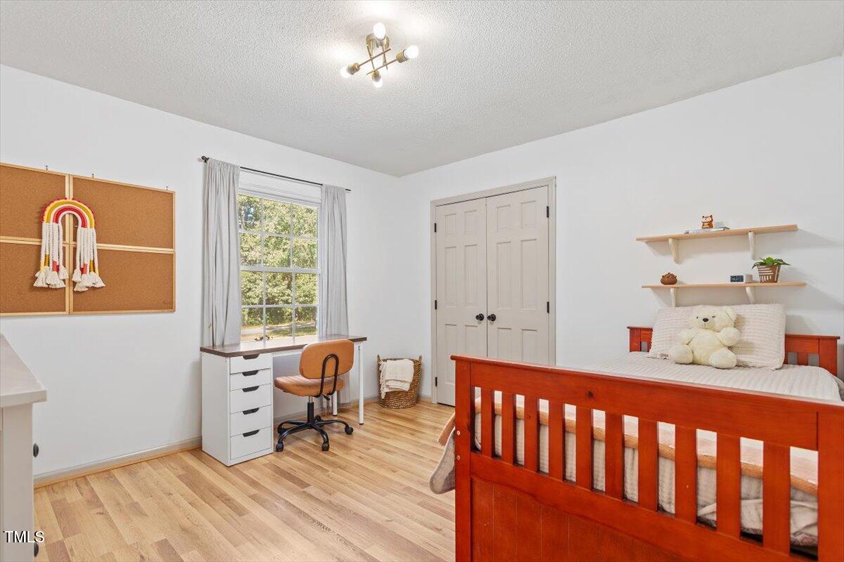 4912 Elizabeth Drive Raleigh, NC 27604 - Photo 22 of 35 a bedroom with furniture and a window