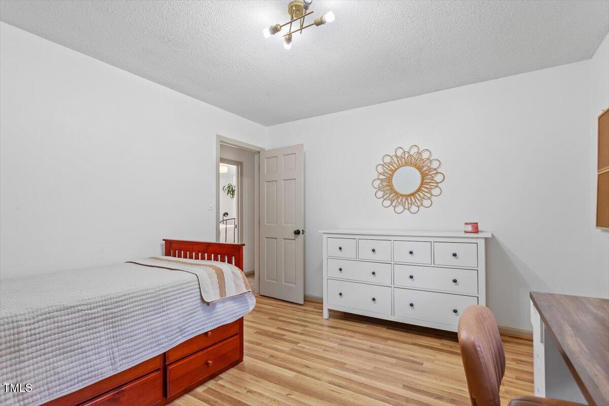 4912 Elizabeth Drive Raleigh, NC 27604 - Photo 24 of 35 a view of a bedroom with wooden floor