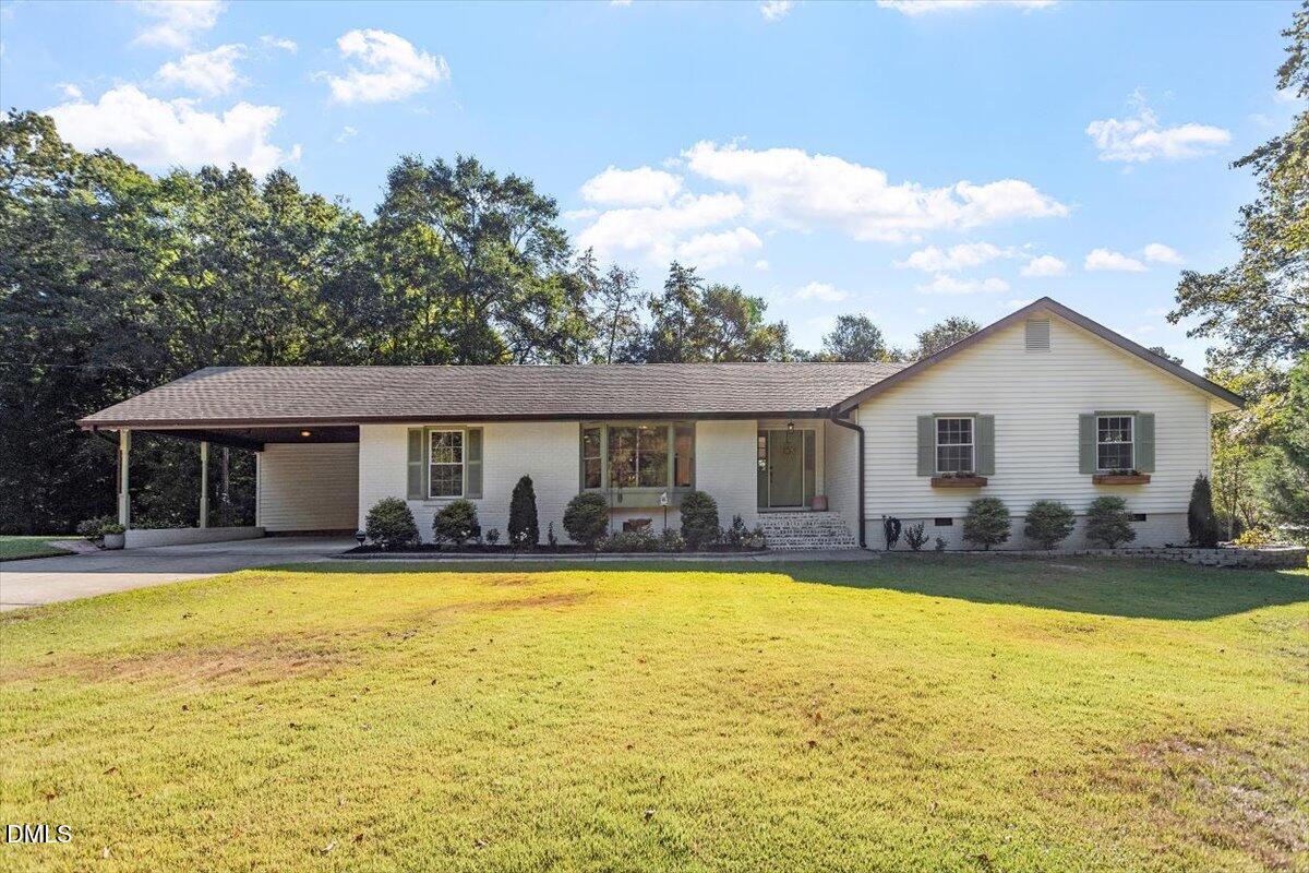 4912 Elizabeth Drive Raleigh, NC 27604 - Photo 2 of 35 a view of a house with swimming pool and a yard
