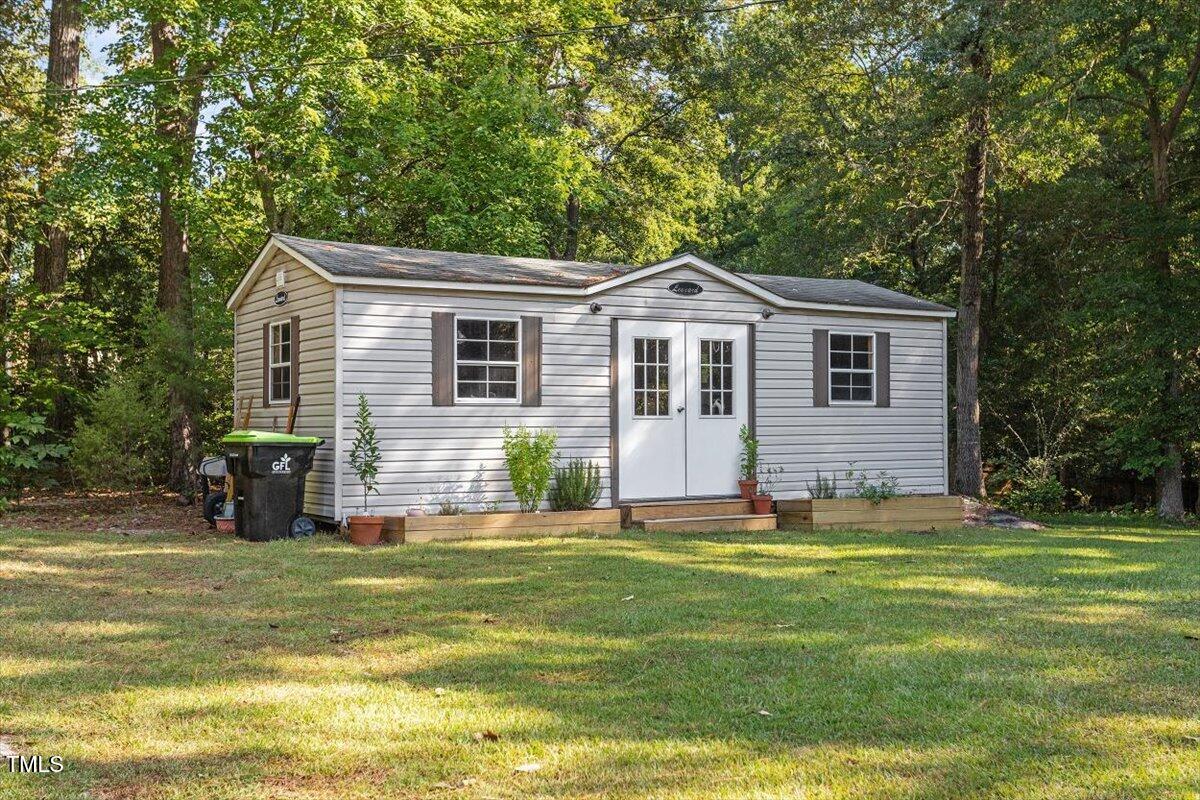4912 Elizabeth Drive Raleigh, NC 27604 - Photo 30 of 35 a view of a house with a yard and sitting area