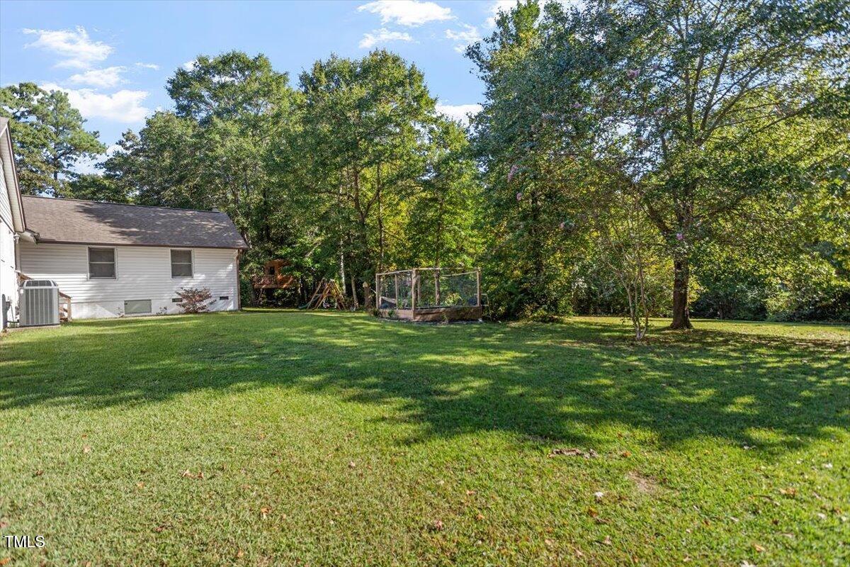 4912 Elizabeth Drive Raleigh, NC 27604 - Photo 32 of 35 a front view of a house with a garden