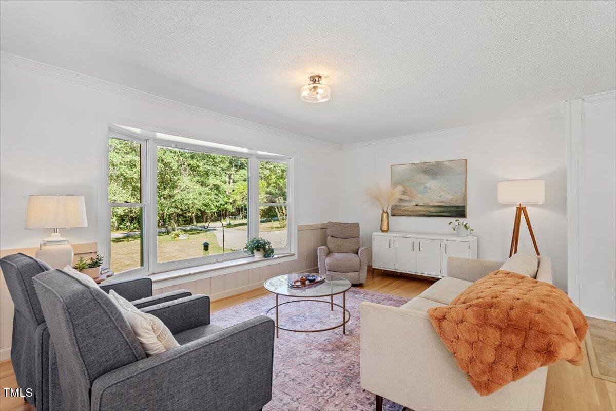 4912 Elizabeth Drive Raleigh, NC 27604 - Photo 3 of 35 a living room with furniture and a large window