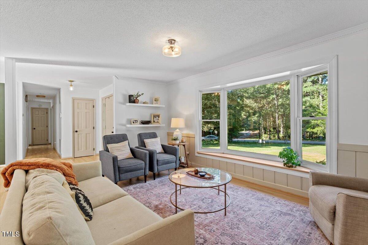 4912 Elizabeth Drive Raleigh, NC 27604 - Photo 4 of 35 a living room with furniture and a large window