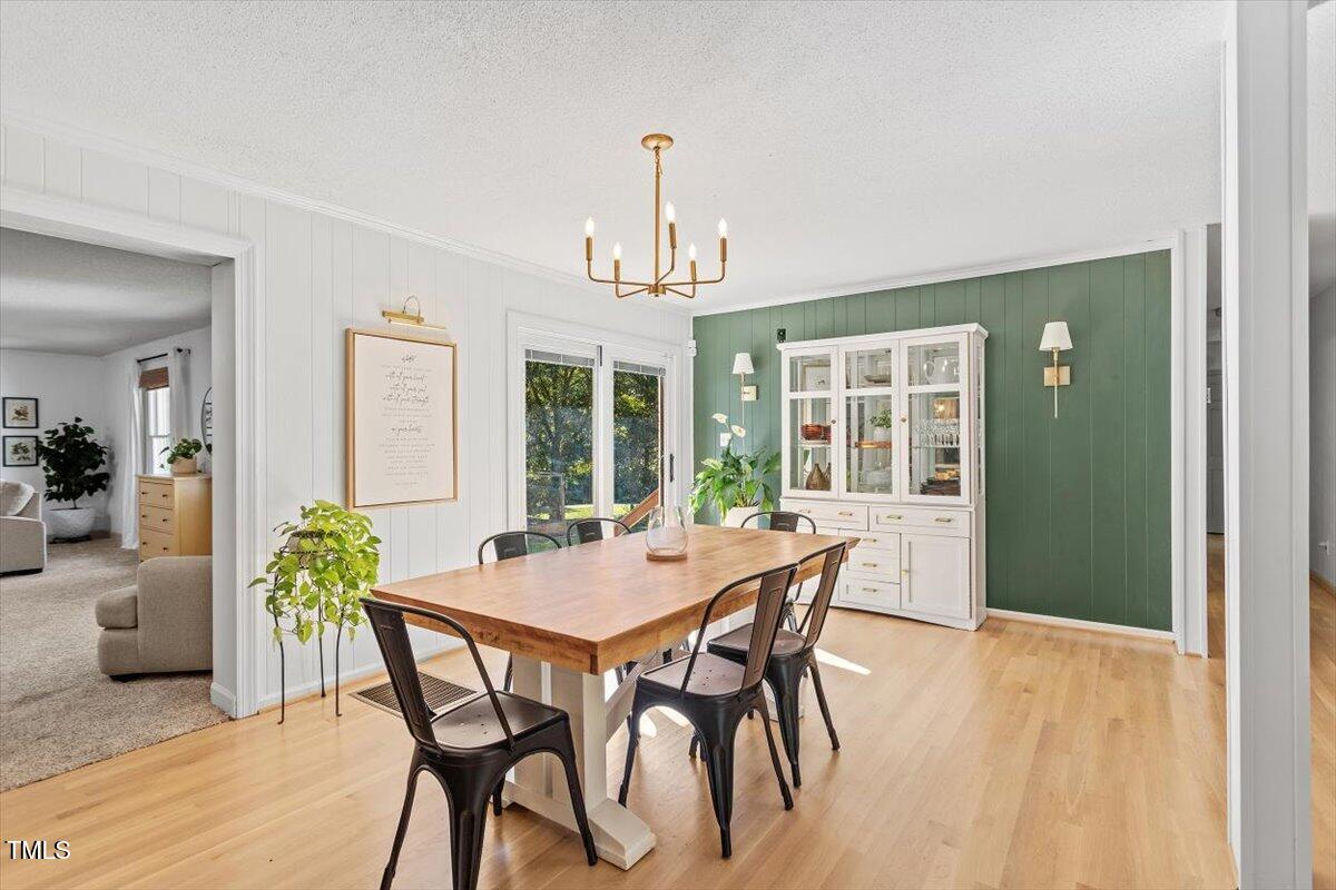 4912 Elizabeth Drive Raleigh, NC 27604 - Photo 5 of 35 a view of a dining room with furniture window and wooden floor