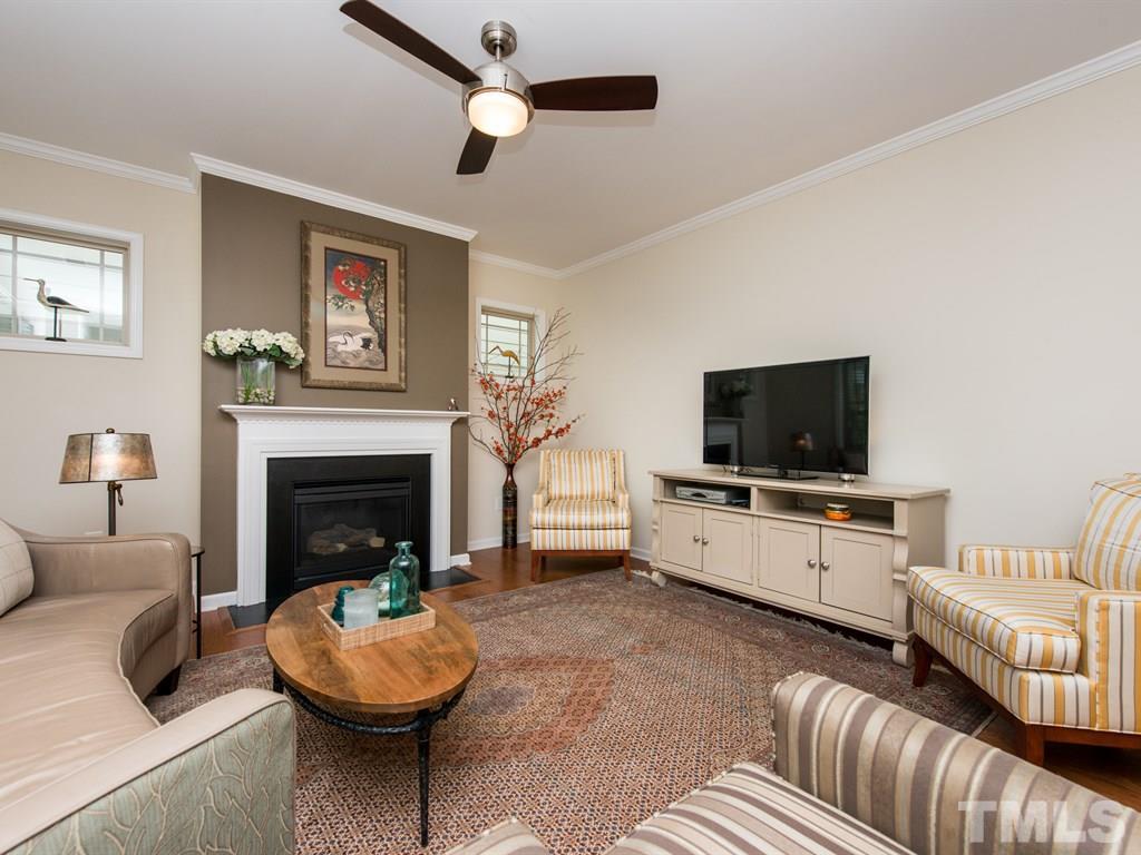 1310 Rodessa Run Raleigh, NC 27607 - Photo 11 of 25 a living room with furniture and a fireplace