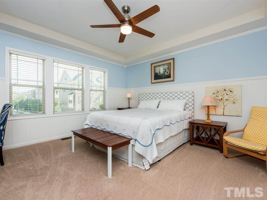 1310 Rodessa Run Raleigh, NC 27607 - Photo 13 of 25 a spacious bedroom with a bed and a large window