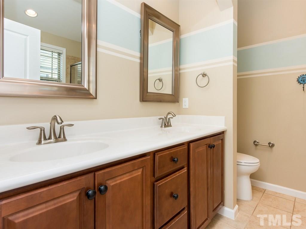 1310 Rodessa Run Raleigh, NC 27607 - Photo 15 of 25 a bathroom with a sink and a toilet